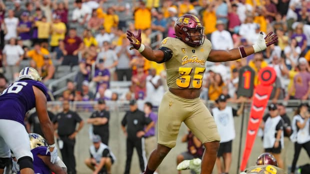BJ Green II celebrates after sacking Michael Penix Jr. in 2022.